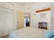 Bedroom featuring a comfortable bed and closet with a door leading to another room at 888 Guild Dr, Venice, FL 34285