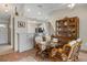 Inviting dining room featuring a glass table with seating for six and decorative display case at 888 Guild Dr, Venice, FL 34285