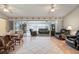 Inviting living room boasts tile floors, ceiling fans, comfortable seating, and sliding glass doors to an outdoor living area at 888 Guild Dr, Venice, FL 34285