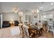 Open-concept living area seamlessly connects the dining space and kitchen, creating a harmonious living space at 888 Guild Dr, Venice, FL 34285