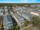 Aerial view of a residential neighborhood showcasing the community and surrounding greenery at 12468 Shimmering Oak Cir, Venice, FL 34293