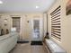 Bright entryway with tile flooring and a glass-paneled front door at 12468 Shimmering Oak Cir, Venice, FL 34293