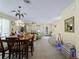 Spacious living area combines dining, living, and entrance space for Gathering and guests at 12468 Shimmering Oak Cir, Venice, FL 34293