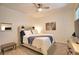Comfortable bedroom with a queen bed, soft lighting, and neutral decor at 12580 Galapagos Ct # 107, Venice, FL 34293