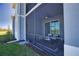 Exterior of condos with screened-in lanais and a view of the golf course on a bright sunny day at 12580 Galapagos Ct # 107, Venice, FL 34293