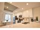 Stylish kitchen with white cabinets, stainless steel appliances, and an island overlooking an outdoor patio at 12580 Galapagos Ct # 107, Venice, FL 34293