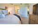 Another view of the main bedroom showing the furnishings and the location relative to other rooms at 12580 Galapagos Ct # 107, Venice, FL 34293