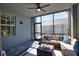 Enclosed patio with comfortable seating, stylish decor, and a tranquil outdoor living space at 12580 Galapagos Ct # 107, Venice, FL 34293