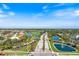 Aerial view of Pelican Point community showing the lush landscaping and the surrounding golf course at 1298 Highland Greens Dr, Venice, FL 34285