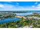 Breathtaking aerial view featuring a lake, verdant landscapes, and city skyline, capturing Florida's scenic beauty at 1298 Highland Greens Dr, Venice, FL 34285