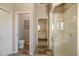 Bathroom with a clear glass enclosed shower and a toilet in a separated room at 1298 Highland Greens Dr, Venice, FL 34285