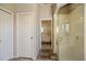 Bathroom featuring glass shower with hallway door and bedroom access at 1298 Highland Greens Dr, Venice, FL 34285