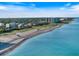 Expansive beachfront property featuring pristine sands and clear blue waters, perfect for relaxation and recreation at 1298 Highland Greens Dr, Venice, FL 34285
