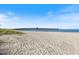 Picturesque beach view leading up to a long pier under a clear, blue sky, perfect for a serene day out at 1298 Highland Greens Dr, Venice, FL 34285