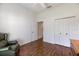 Bright bedroom with hardwood floors and ample closet space at 1298 Highland Greens Dr, Venice, FL 34285