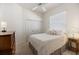 Cozy bedroom with natural light, featuring a comfortable bed and a double door closet at 1298 Highland Greens Dr, Venice, FL 34285