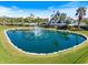 Pelican Pointe Golf & Country Club community entrance with fountain and lush landscaping at 1298 Highland Greens Dr, Venice, FL 34285