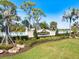 Pelican Pointe Golf & Country Club community sign with lush landscaping and beautiful green grass at 1298 Highland Greens Dr, Venice, FL 34285