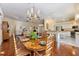 Spacious dining room open to the living room and kitchen, ideal for gatherings at 1298 Highland Greens Dr, Venice, FL 34285