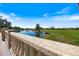 Scenic view of a golf course and a tranquil pond at Pelican Pointe Golf & Country Club at 1298 Highland Greens Dr, Venice, FL 34285