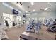 Bright gym with modern equipment, high ceilings, fans, and large windows at 1298 Highland Greens Dr, Venice, FL 34285