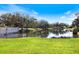 Scenic view of a tranquil pond surrounded by lush greenery at Pelican Pointe Golf & Country Club at 1298 Highland Greens Dr, Venice, FL 34285