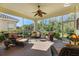 Spacious screened porch with ample seating, perfect for entertaining and enjoying the outdoors at 1298 Highland Greens Dr, Venice, FL 34285