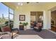 Relaxing screened porch with stylish decor and seamless transition to outdoor living at 1298 Highland Greens Dr, Venice, FL 34285