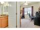 Bathroom and office featuring a shared vanity with granite counters and a view of the neighborhood at 13238 Famiglia Dr, Venice, FL 34293