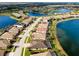 Aerial view of the residential community with multiple lakes and lush surroundings at 13238 Famiglia Dr, Venice, FL 34293