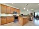 Modern kitchen with stainless steel appliances, granite countertops, and center island at 13238 Famiglia Dr, Venice, FL 34293