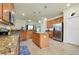 Spacious kitchen with a center island, stainless steel appliances, and ample cabinet space at 13238 Famiglia Dr, Venice, FL 34293