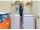 Convenient laundry room equipped with a washer, dryer, and overhead storage shelf at 13238 Famiglia Dr, Venice, FL 34293