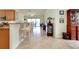 Spacious living area with tile flooring and seamless transition to the outdoor space at 13238 Famiglia Dr, Venice, FL 34293