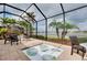 Outdoor spa with water features overlooking the lake at 13238 Famiglia Dr, Venice, FL 34293