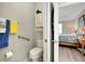 Ensuite bathroom with toilet, closet, towel bar, and adjacent bedroom at 13730 Vancanza, Venice, FL 34293