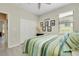 Bedroom with ceiling fan, a double closet, and wall art at 13730 Vancanza, Venice, FL 34293
