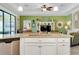Kitchen island offering seating, sink, dishwasher and open sight lines to the living room at 13730 Vancanza, Venice, FL 34293