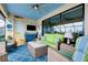 The screened lanai features comfortable seating and a view of the lake at 13730 Vancanza, Venice, FL 34293