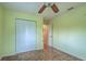 Simple bedroom with a spacious closet and neutral flooring, offering practicality and comfort at 1700 Manasota Beach Rd, Englewood, FL 34223