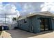 Home exterior features a well-maintained yard, painted stucco and a large driveway at 174 Venice East Blvd, Venice, FL 34293