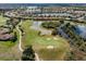 Aerial view of a community featuring lakes, a golf course, and residential homes at 190 Montelluna Dr # North, North Venice, FL 34275
