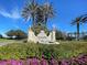 Beautiful entrance to the Venetian Golf and River Club, with lush landscaping and attractive signage at 190 Montelluna Dr # North, North Venice, FL 34275