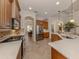 Well-equipped kitchen featuring stainless steel appliances, stone countertops, and ample cabinet space at 190 Montelluna Dr # North, North Venice, FL 34275