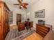 Well-appointed home office with wood floors, built-in shelving, and a classic wooden desk at 190 Montelluna Dr # North, North Venice, FL 34275