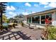 Enjoy the backyard oasis complete with a koi pond, wood-fired hot tub and beautiful patio at 225 Randolph Rd, Venice, FL 34293
