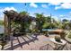 Backyard featuring a brick patio, koi pond, pergola, and wood fired hot tub at 225 Randolph Rd, Venice, FL 34293
