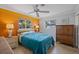 Bright bedroom featuring a ceiling fan, two windows with plenty of natural light at 225 Randolph Rd, Venice, FL 34293