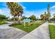 Entrance to Centennial Park with manicured landscaping and signage at 225 Randolph Rd, Venice, FL 34293