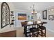 A charming dining area with a large table, comfortable seating and stylish lighting at 225 Randolph Rd, Venice, FL 34293
